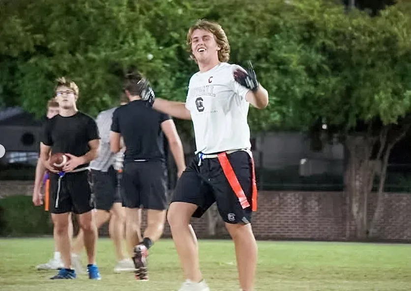 Flag football players celebrating together after a play