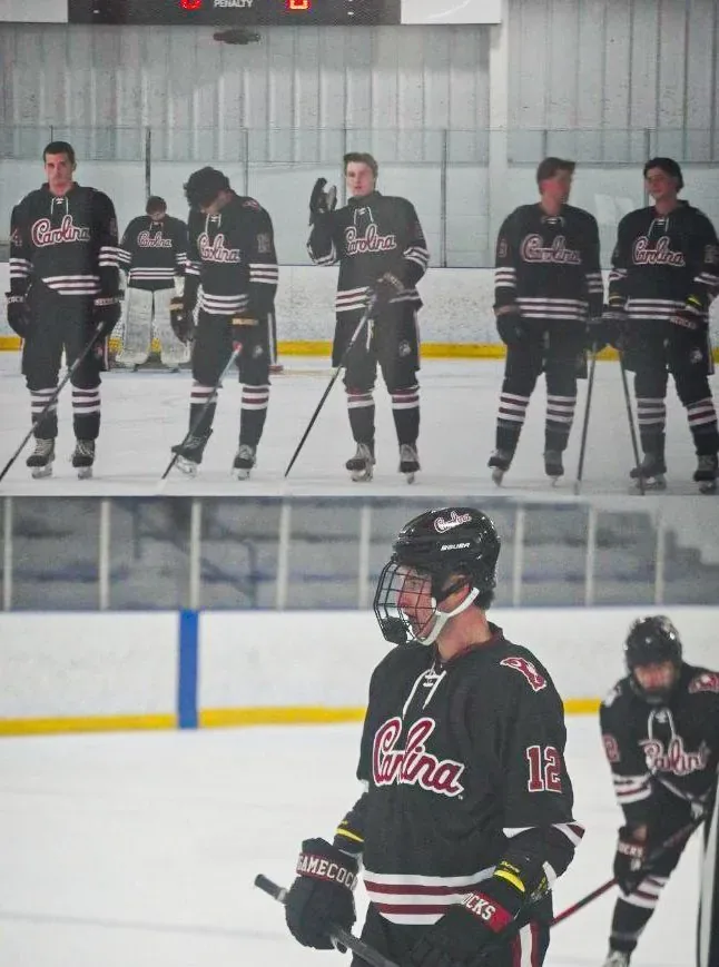 Carolina players lined up on the blue line for the national anthem