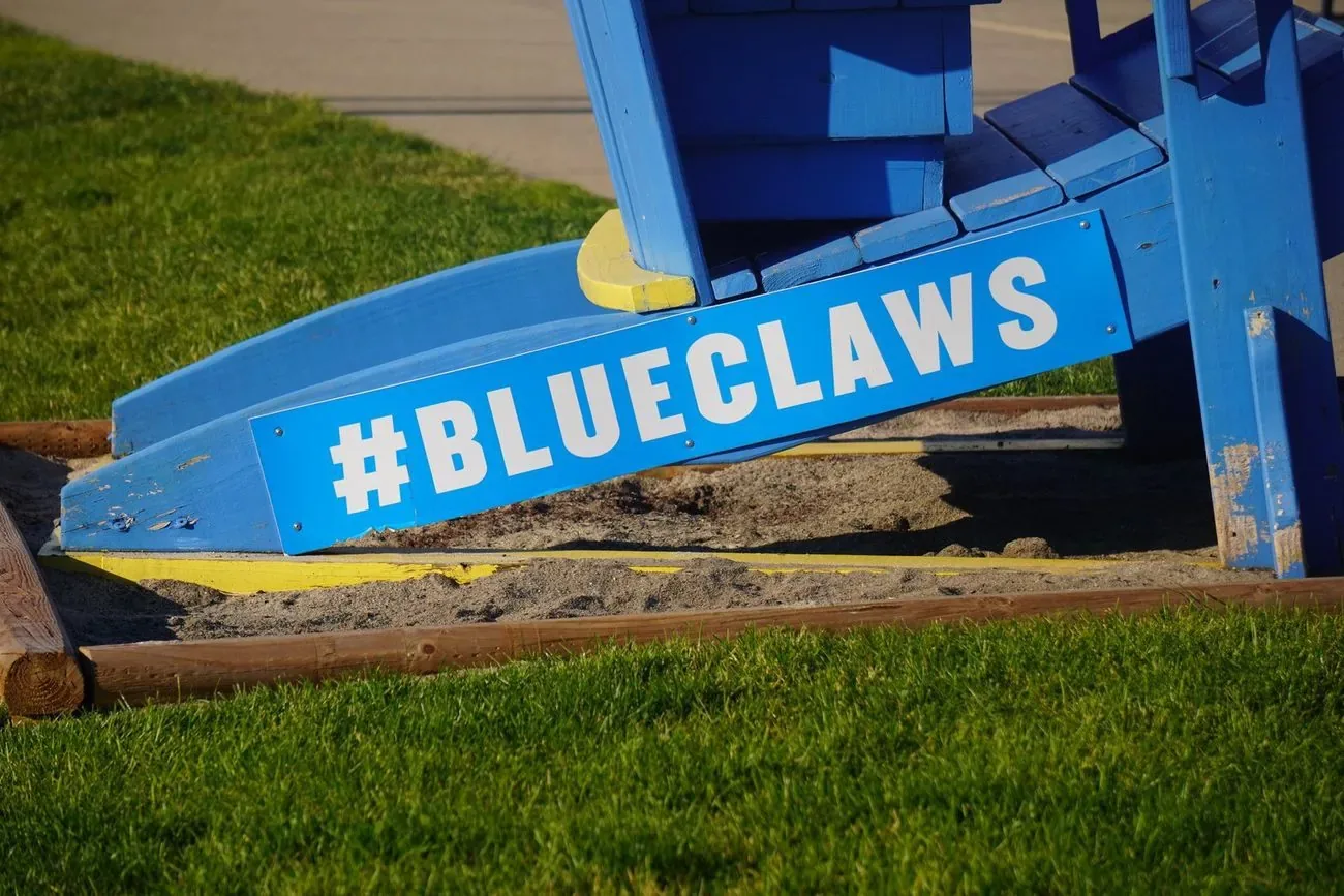 Oversized blue Adirondack chair painted with the hashtag BlueClaws