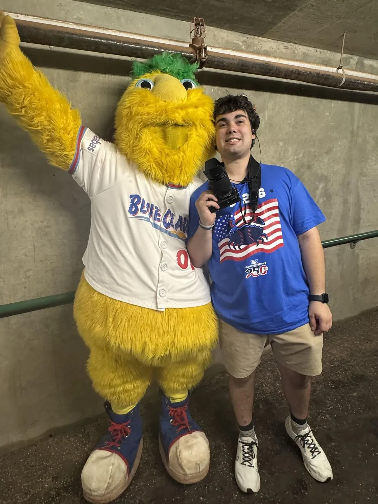 Mitchell Zavoda standing with Buster, the Jersey Shore BlueClaws mascot
